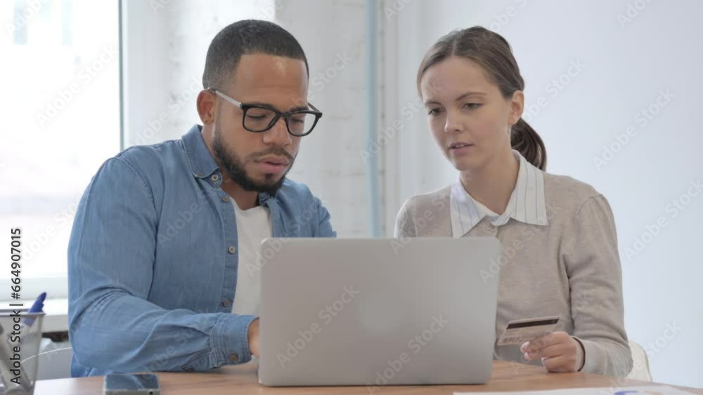 Multi Ethnic Casual People Enjoying Online Shopping in Office Multi Ethnic Casual People Enjoying Online Shopping in Office
