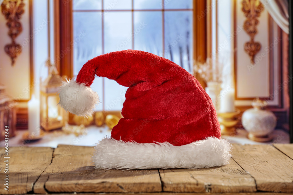 Obraz premium Red santa claus hat and winter window. 