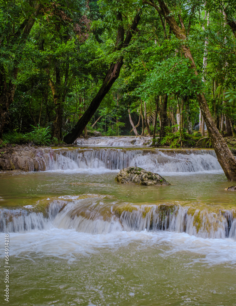 Fototapeta premium a beautiful deep forest waterfall in Thailand. Erawan Waterfall in National Park