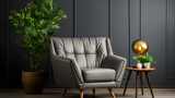Grey recliner wingback chair against black paneling wall. Scandinavian home interior design of modern living room