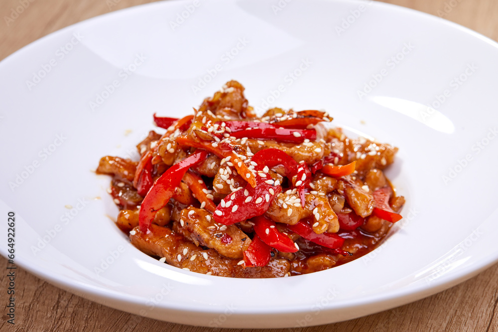 crispy fried sesame chicken in white plate crispy fried sesame chicken in white plate