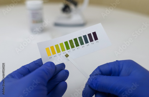 Bacterial Vaginosis. Vaginal pH. Diagnostic. Scale by which you can measure whether acidity normal or not. Normal acidity level shown in colors and must be compared with standard. Laboratory and home photo