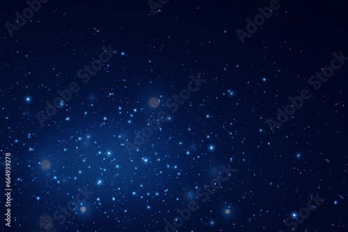  Background of falling particles of magic dust. Energy light of blue dust particles. © Hanna