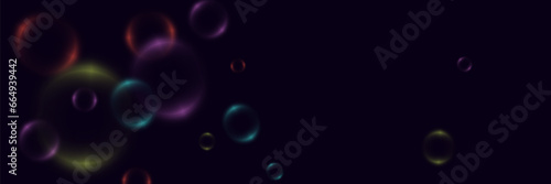 Abstract background with neon bubbles, iridescent colorful glass balls or spheres on a black background. 