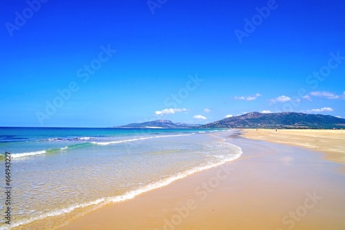 gorgeous beach in Tarifa with a view towards the dune of Valdevaqueros at a beautiful summer day, Playa de los Lances, Playa Santa Catalina, Andalusia, province of Cádiz, Spain