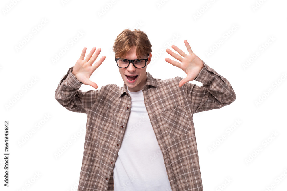 close-up portrait of a young handsome caucasian man with red short hair in glasses and a shirt on a white background close-up portrait of a young handsome caucasian man with red short hair in glasses and a shirt on a white background