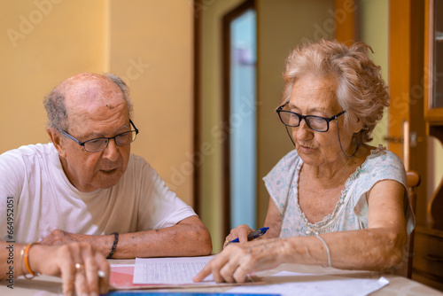 Grandparents doing memory exercises at home photo