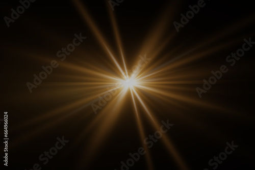 Flare light effect. Flash light with rays and lens. On a black background.