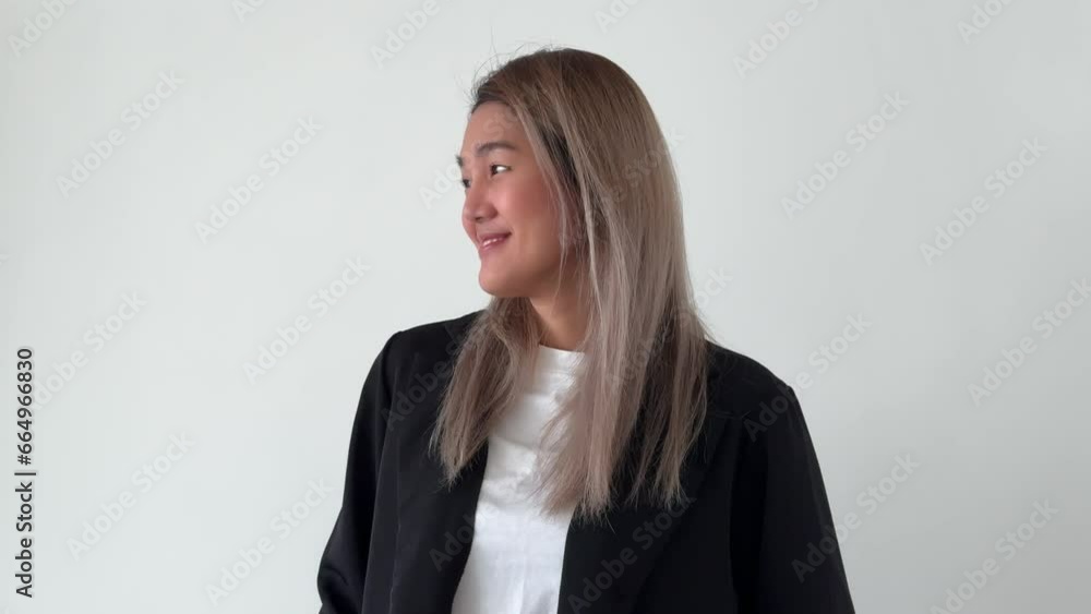 Happy smile face of asian business secretary woman in casual suit stand on white wall. Happy smile face of asian business secretary woman in casual suit stand on white wall.