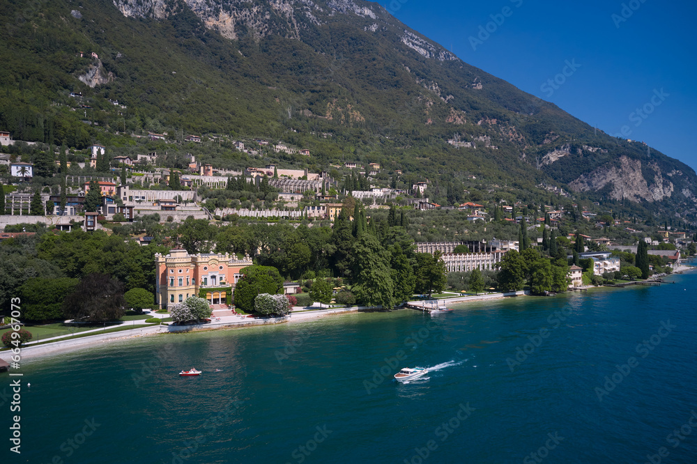 Coastline of the resort town of Gargnano Lake Garda Italy. Aerial panorama of Gargnano city located on Lake Garda Italy.