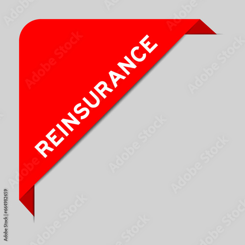 Red color of corner label banner with word reinsurance on gray background