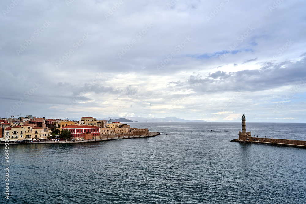 Port quay and historic lighthouse in the town of Chania on the island of Crete