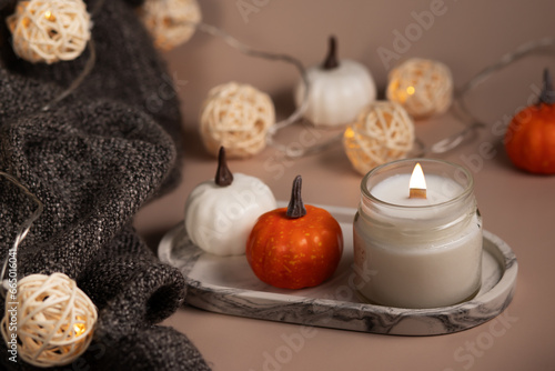 handmade candle and cozy blanket, warmth to the home interior, comforting home atmosphere