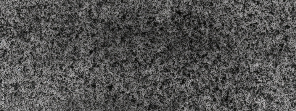 Fototapeta premium Seamless subtle gritty film grain texture photo overlay. Vintage dark black and white speckled noise, grit and grunge background. Abstract fine splattered spray paint particles on paper backdrop