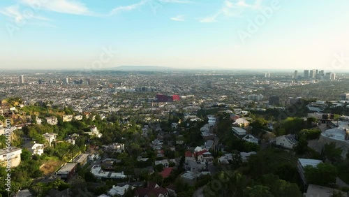 Drone flying towards luxurious mansions on Hollywood Hills in Los Angeles. luxury residences and villas in Hollywood Hills. 