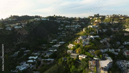 Drone flying towards luxurious mansions on Hollywood Hills in Los Angeles. luxury residences and villas in Hollywood Hills. 