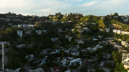 Drone flying towards luxurious mansions on Hollywood Hills in Los Angeles. luxury residences and villas in Hollywood Hills. 