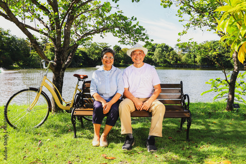 Portrait retired asian senior couple good mental health good mood ้healthy couple cheerful healthy garden outdoor garden where the air is clear and shady pure looking at camera smiling happily. Portrait retired asian senior couple good mental health good mood ้healthy couple cheerful healthy garden outdoor garden where the air is clear and shady pure looking at camera smiling happily.