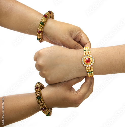 raksha Bandhan A sister is binding rakhi on her brother s hand on the occasion of raksha Bandhan photo