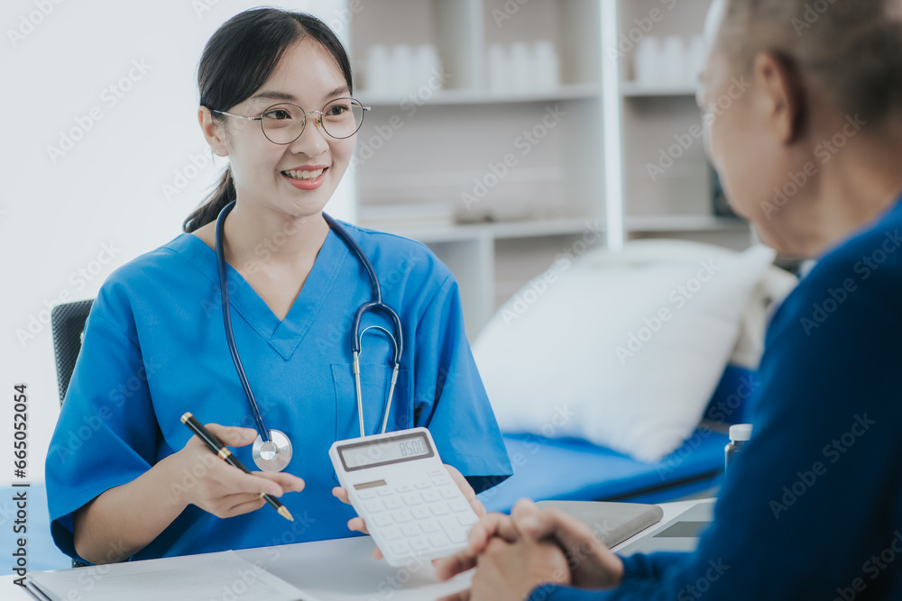 Fototapeta premium A male patient visits a female doctor at the clinic. Medical worker writes prescriptions on the table in the hospital