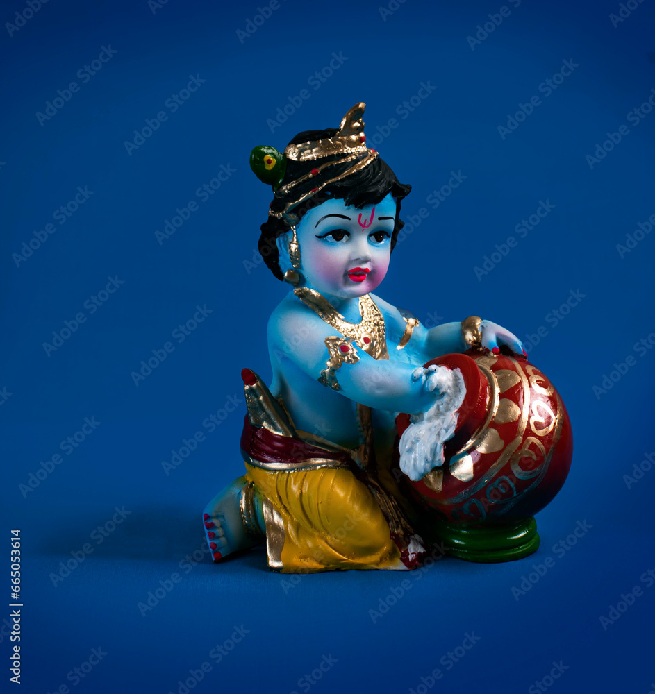 Hindu God Krishna on blue background indian dahi handi festival