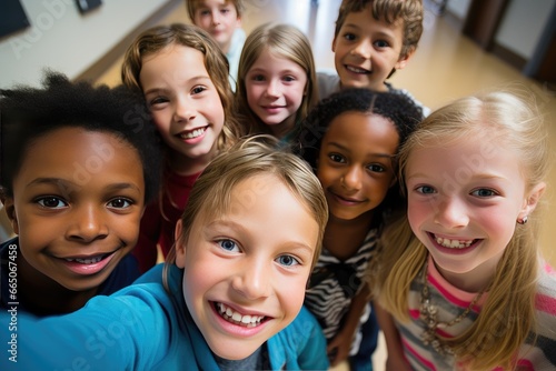 Class selfie in an elementary school. Kids taking a picture together in a co-ed school © Alfonso Soler