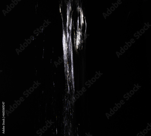 Water pour on black background