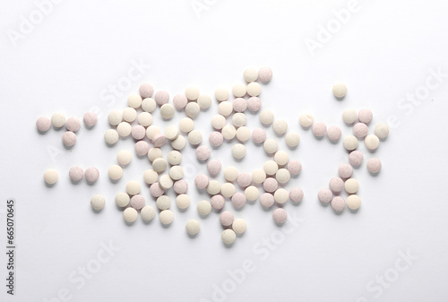 Vitamin pills for animals on white background