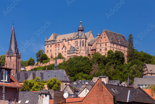 View of the stone castle on a hill in Marburg on a sunny morning.