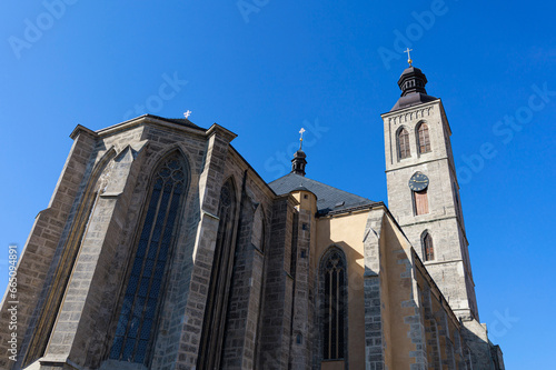 Church of saint James (Kostel svateho Jakuba), Kutna Hora, Czech Republic, Czechia. Old medieval gothic religious and sacral bulding. Architecture and landmark. Sunny with blue sky. photo