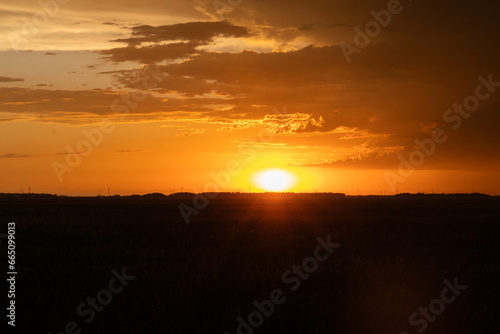 Sunsetting over rural Manitoba field © Riley