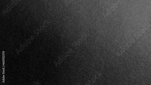 Surface of black paper. Seamless loop rotating. Use for background and texture. photo