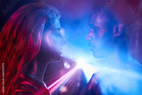 Couple in Intense connection in vibrant light photo