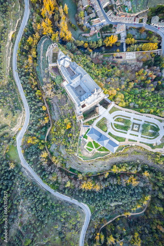 Drone view of castle city highway green and autumn trees in daytime photo
