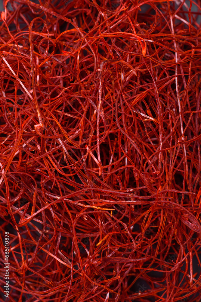 Fototapeta premium Red thin hot chili threads on a dark background