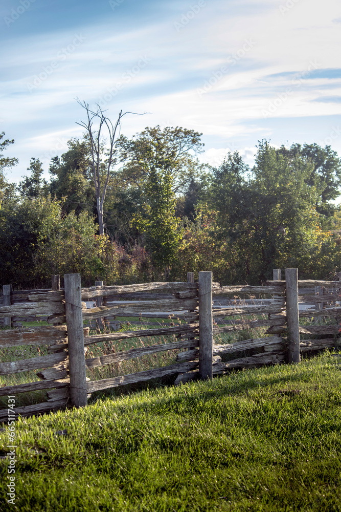 Old fence around a rural grass field