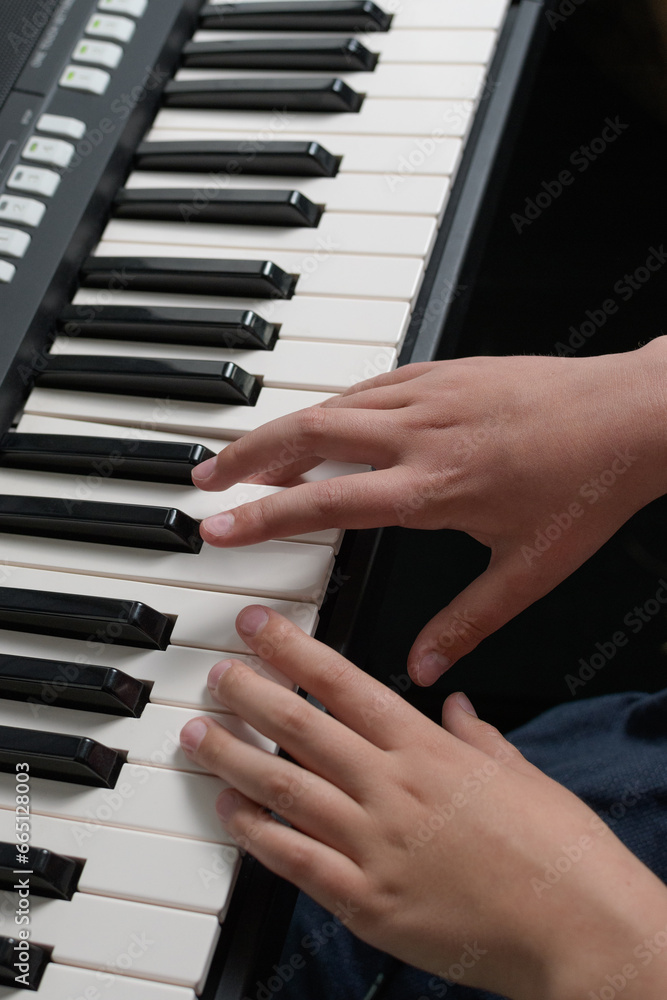 Piano music lessons. two hands playing chords and scales exercizes. Synthesizer keyboard close-up. Piano music lessons. two hands playing chords and scales exercizes. Synthesizer keyboard close-up.