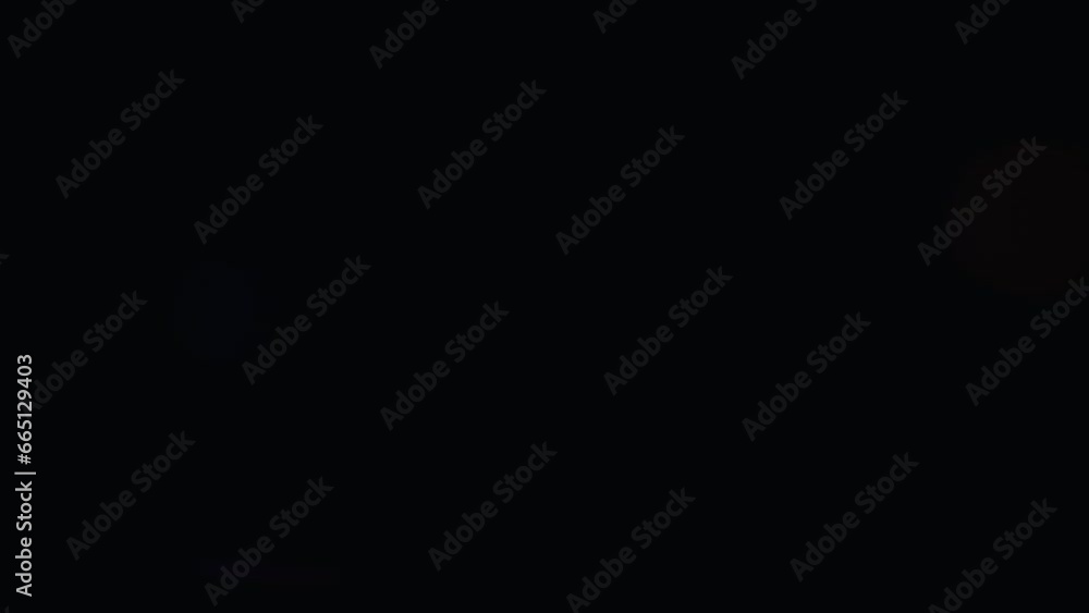 Abstract overlay with small spot light transition, lens flare flashes effects on dark background. Anamorphic lens flares. Abstract overlay with small spot light transition, lens flare flashes effects on dark background. Anamorphic lens flares.