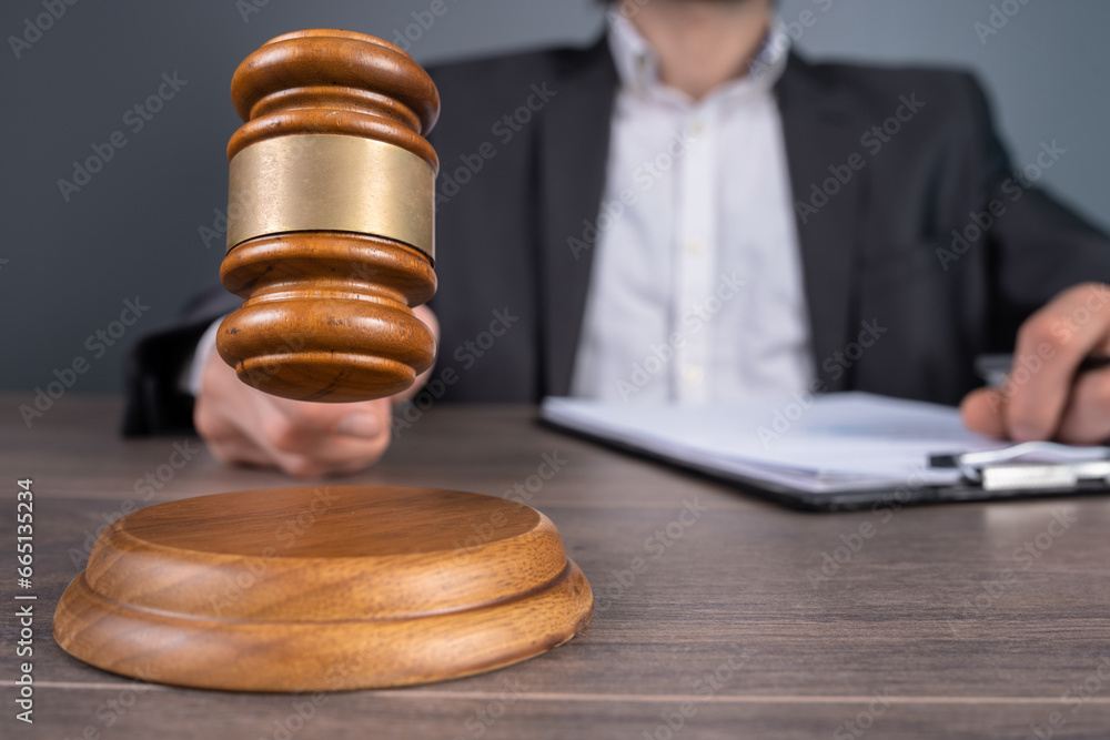 The judge hits the gavel The judge hits the gavel