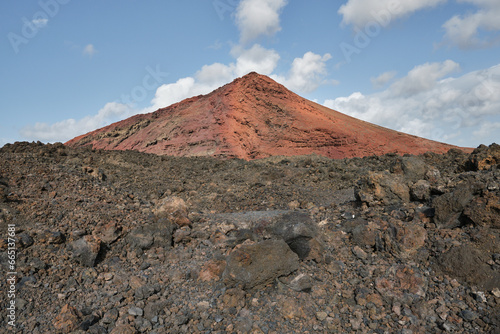 View of a dormant volcano with lava flow in the foreground on Lanzarote  Canary Islands  Spain. 