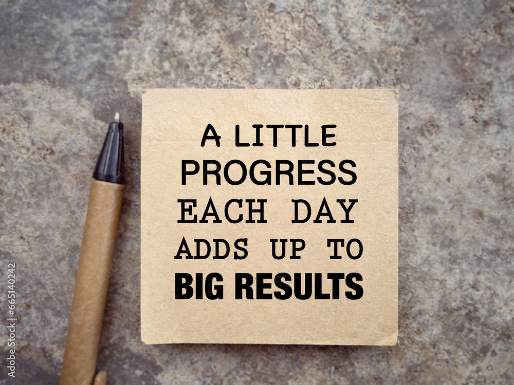 Motivational and inspirational wording. A LITTLE PROGRESS EACH DAY ADDS UP TO BIG RESULTS written on a notepad. With blurred styled background. Motivational and inspirational wording. A LITTLE PROGRESS EACH DAY ADDS UP TO BIG RESULTS written on a notepad. With blurred styled background.