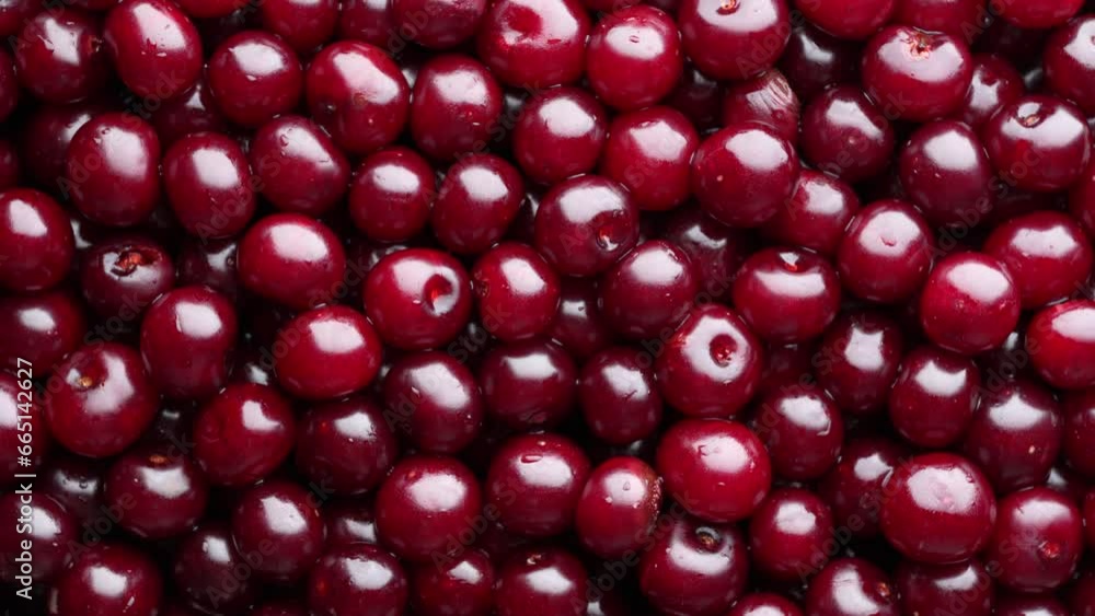 Ripe red cherry rotating, close up, top view. Vegetarian meal, healthy and useful. Background of fresh red cherries Ripe red cherry rotating, close up, top view. Vegetarian meal, healthy and useful. Background of fresh red cherries