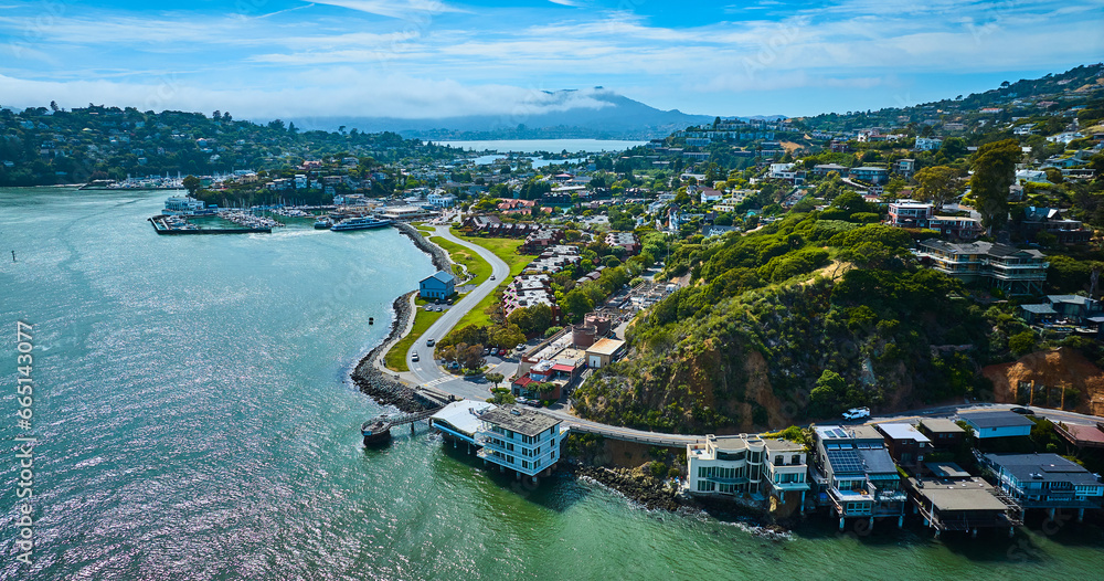 Racoon Strait around Tiburon city with houses on hillside wide aerial with Corinthian Yacht Club