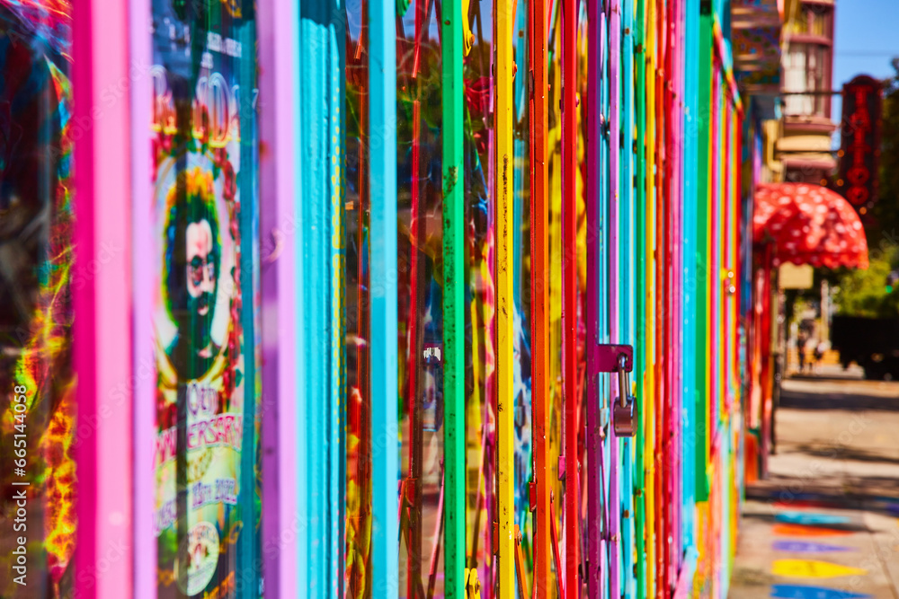Pride rainbow gate with padlock side view along street Pride rainbow gate with padlock side view along street