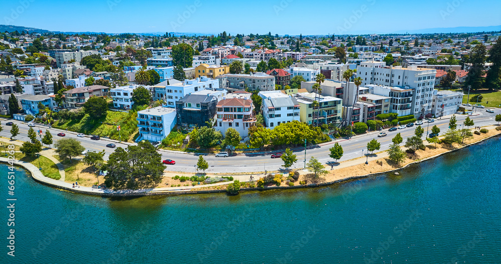 Oakland aerial of residential area with road along lakeshore and blue sky