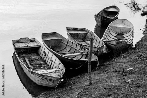 Obraz na płótnie fishing boat on the river bank w salonie