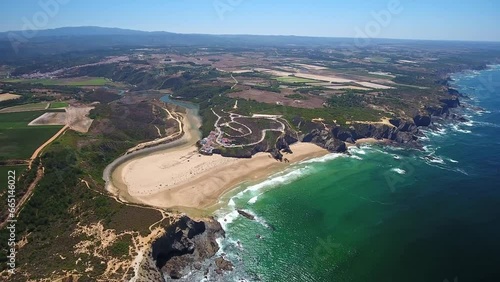 Aerial video filming by drone of sea bay and beach near village of Odeceixe Alentejo Portugal. Bird's eye view of the Alentejo region