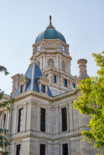 Clock tower on tall Whitley County Courthouse with castle like architecture