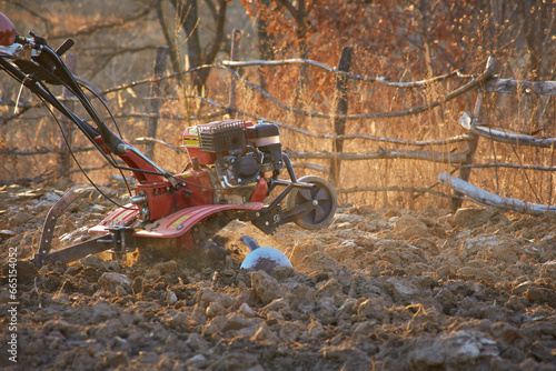 motor cultivator that digs the ground for growing vegetables
