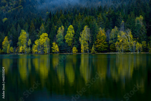Obraz na płótnie reflections with forest in autumn lake, Sf Ana lake w salonie